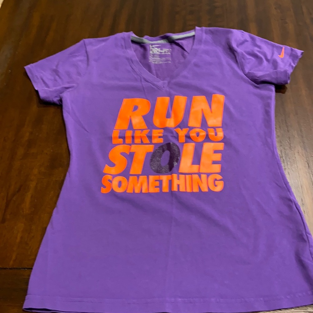 Nike dry fit workout shirt in size small. Purple shirt with orange writing.